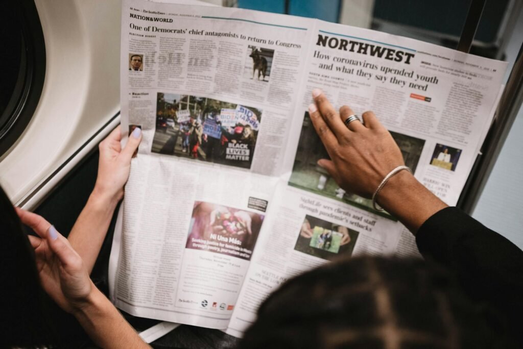 close up of people reading newspaper